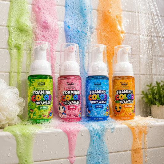 Four Twisted Soap Bar Foaming Color Body Wash bottles in Green, Pink, Blue, and Orange on a wet bathroom ledge